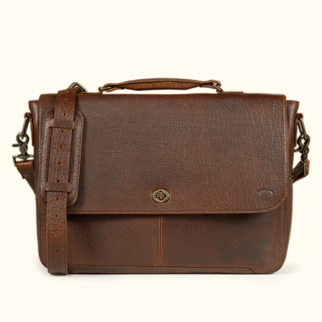 Roosevelt Messenger Bag holding a 13", 14" or 115" laptop in the padded interior sleeve — full-grain Buffalo Grain leather