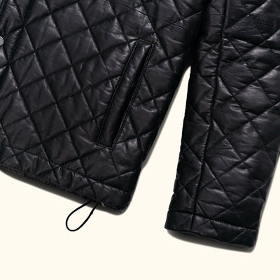The high collar adds an extra layer of protection against the elements while maintaining a sharp and polished look.